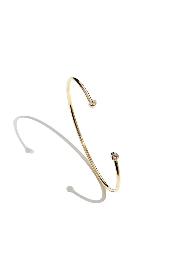 Plain bracelet with two white cubic zirconia stones.